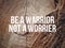 Be a warrior not a worrier text with vintage background. Inspirational motivational quote.Â 